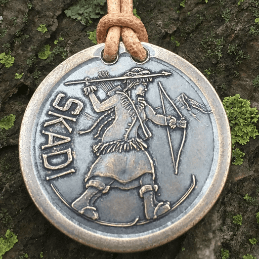 Necklace on leather cord of Norse goddess Skadi on skis with bow