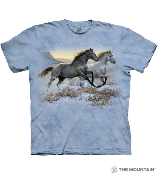 Mottled light blue tee with two horses running in front of mountains and setting sun in snowy winter