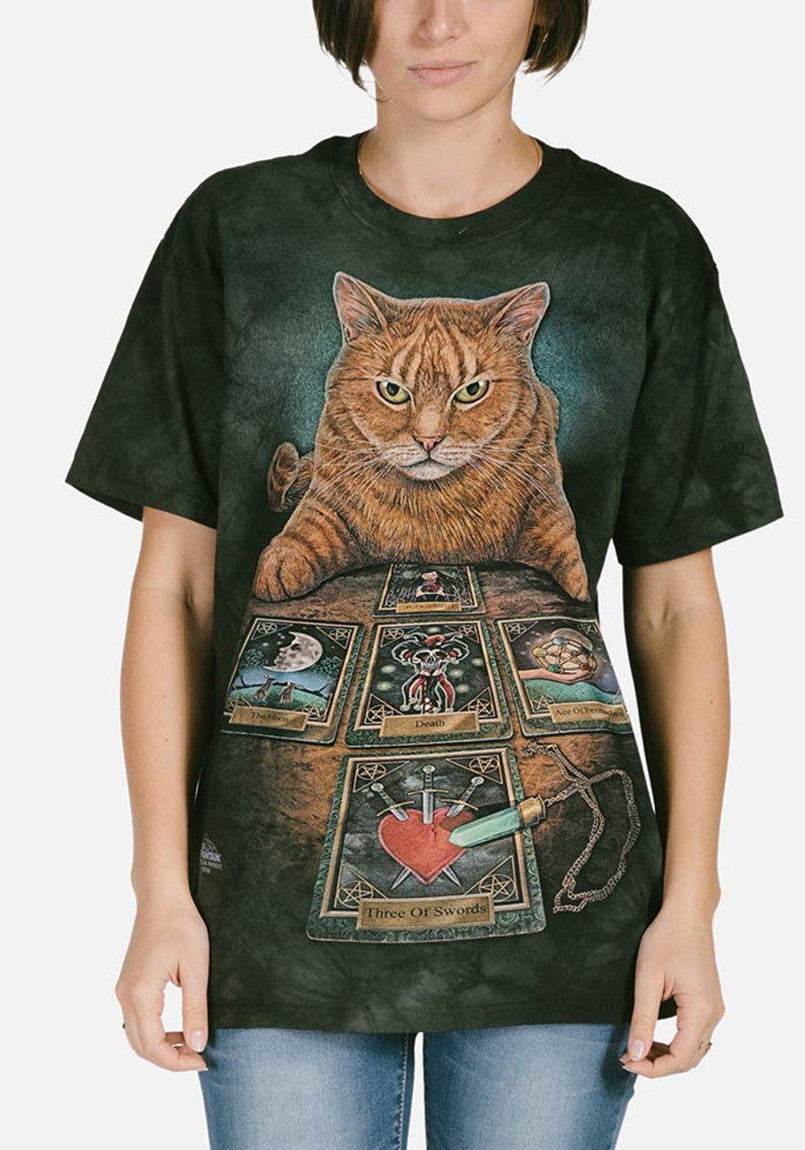 Black mottled tee shirt with orange tabby cat sitting in front of tarot cards and crystal