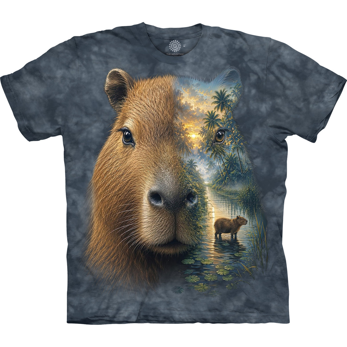 A short-sleeve crewneck t-shirt featuring a detailed graphic print of a capybara. The left side of the capybara face is rendered in realistic brown fur, while the right side blends into a scenic forest landscape with a smaller capybara standing in water under a glowing sky.