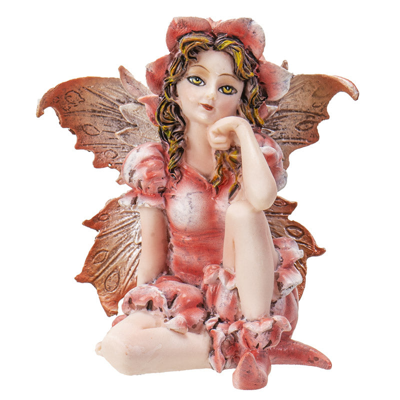 Fairy figurine, pink dress, wings and flower hat. Blond-streaked brown hair with golden yellow-brown eyes
