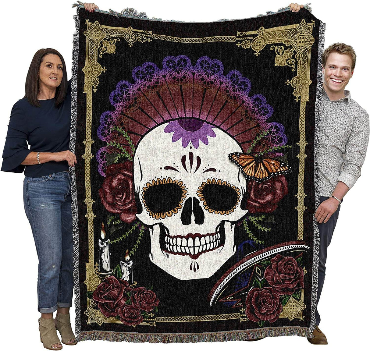 Day of the Dead tapestry blanket shown held up by two adults,