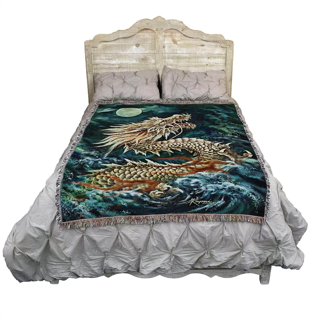 Moon and Sea Dragon tapestry shown on a bed