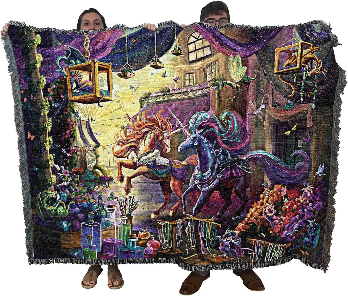 Tapestry blanket held by two adults to show large size