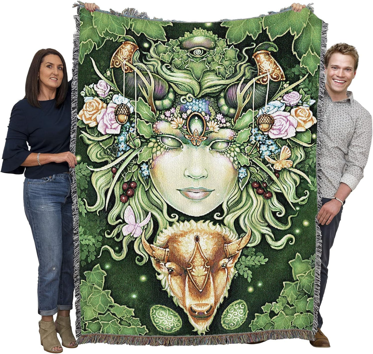 Tapestry blanket, face of Gaia, Greenwoman, with flowers, acorns, butterflies and a bison beneath, surrounded by leaves. Held up by two adults to show large size