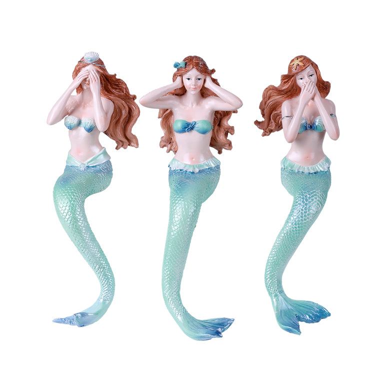Three mermaid figurines with different poses see, hear, and speak no evil