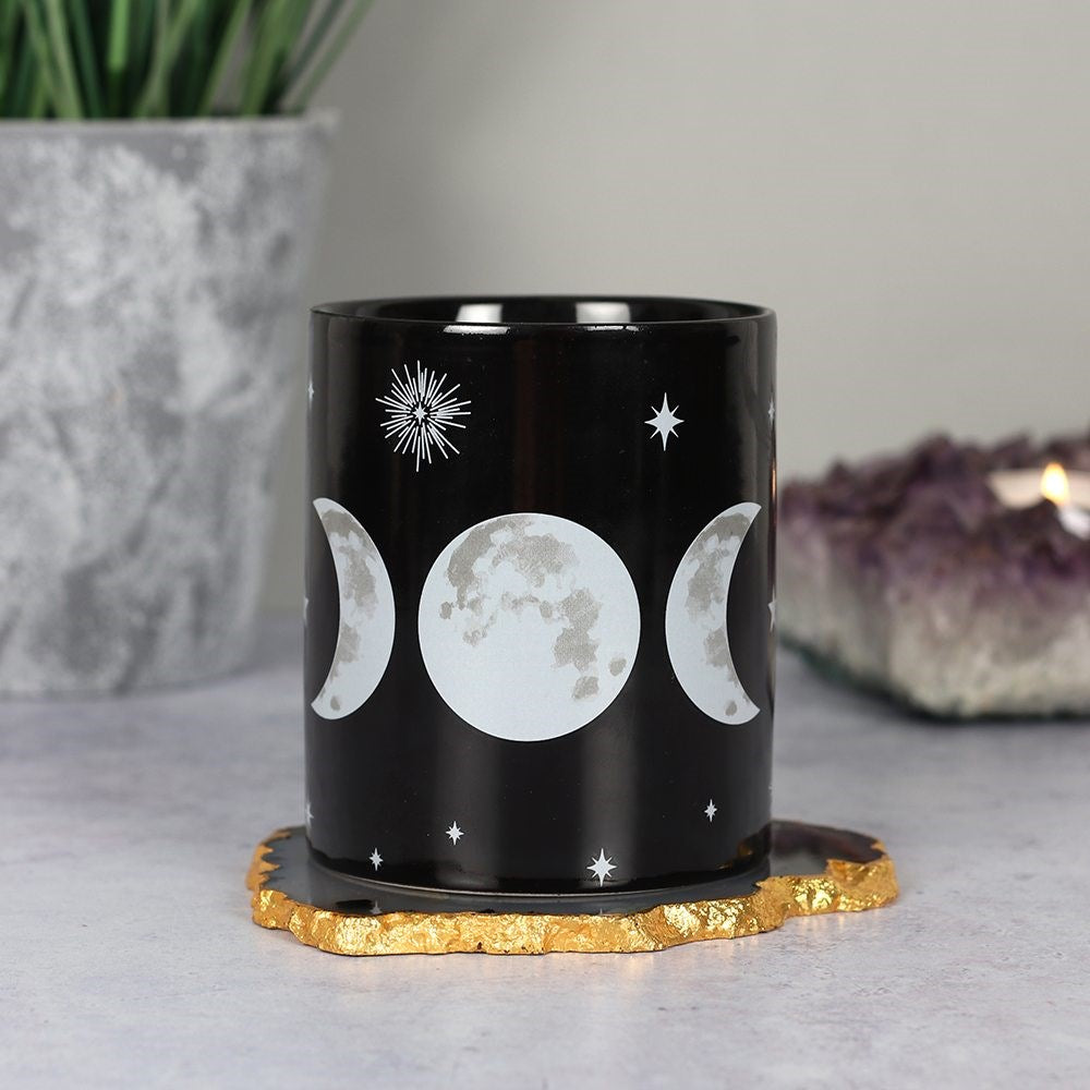 Black ceramic mug with white triple moon and star designs