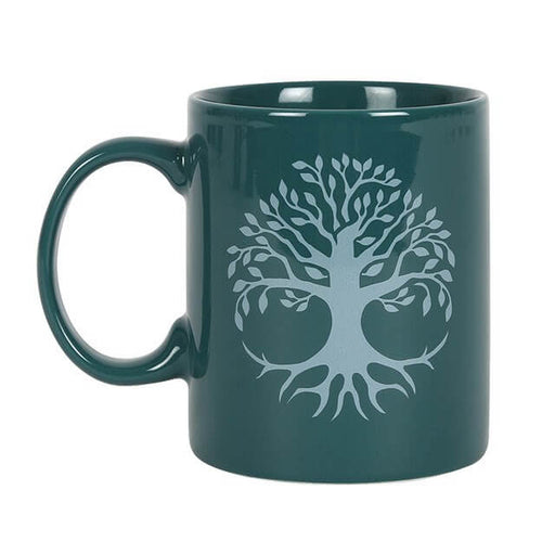 Green ceramic mug with silver-white tree of life design