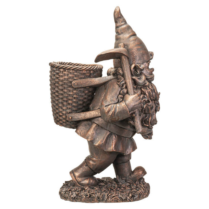 Bronze garden gnome with pickaxe and basket on his back, floral planter