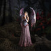 Fairy in pink and baby dragon figurine shown in dark forest setting