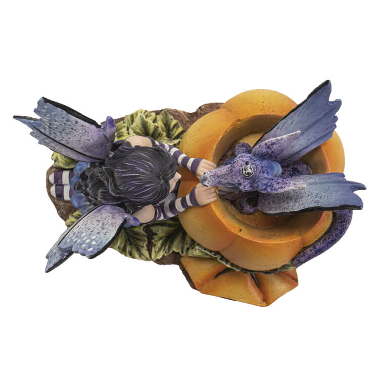 Dark haired fairy with purple wings and dress and striped sleeves & Stockings kneels in front of a pumpkin with a periwinkle dragon popping out, shown top down