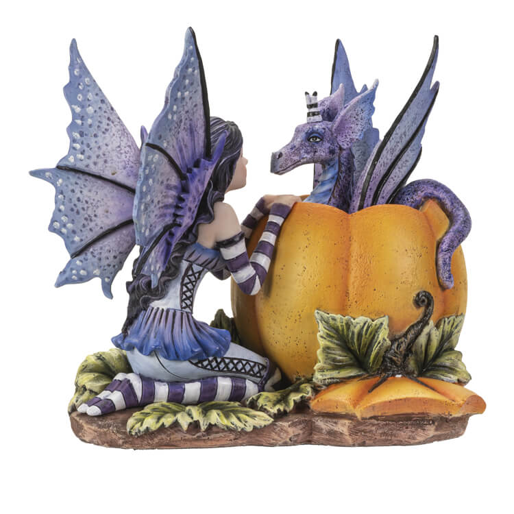 Dark haired fairy with purple wings and dress and striped sleeves & Stockings kneels in front of a pumpkin with a periwinkle dragon popping out