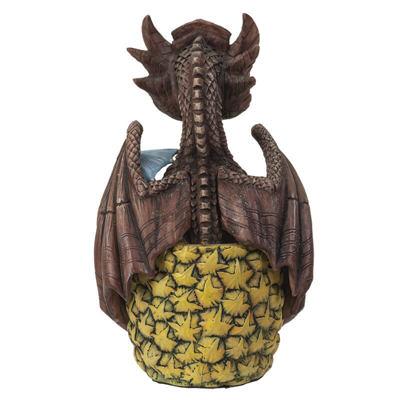 Mai Tai dragon with brown scales sitting in pineapple holding a cherry, with a blue drink umbrella. Shown from the back