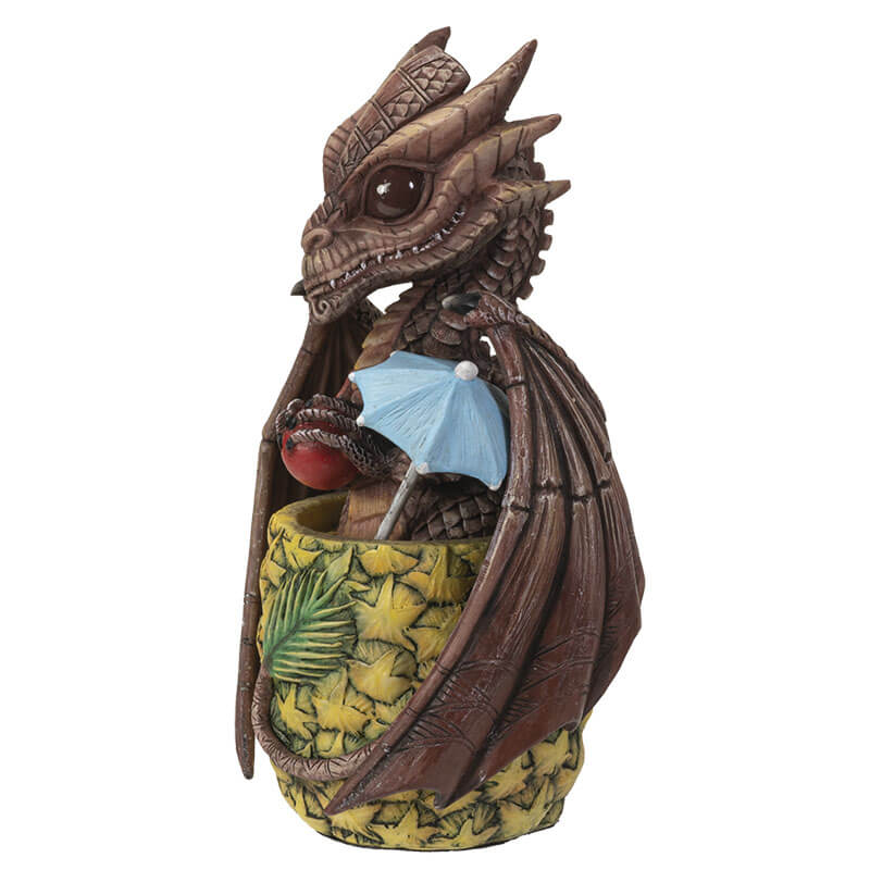 Mai Tai dragon with brown scales sitting in pineapple holding a cherry, with a blue drink umbrella