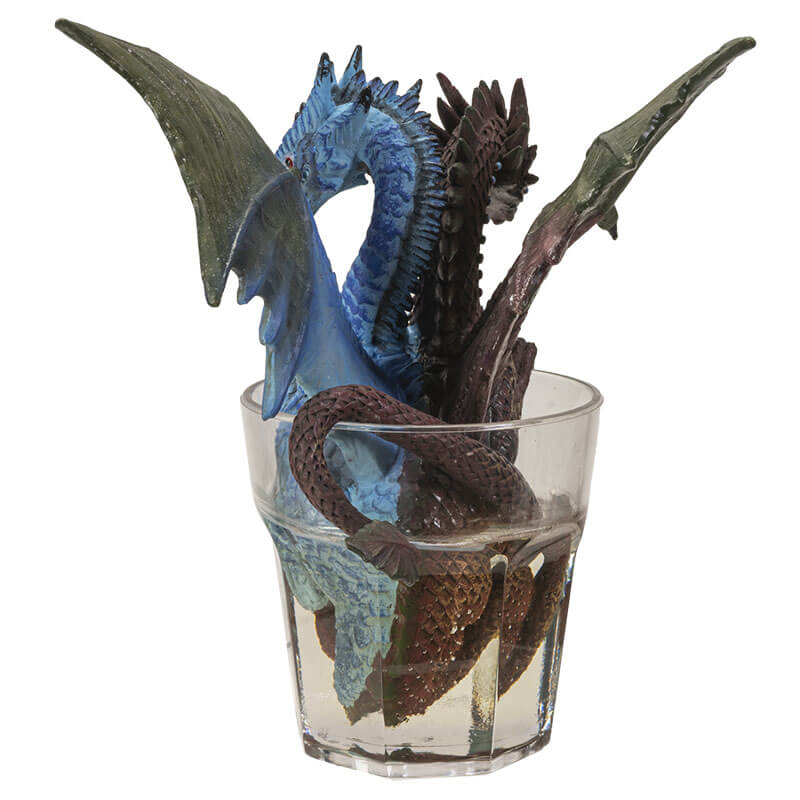 Two headed gin & tonic dragon with blue and brown heads, sitting in glass of clear resin drink
