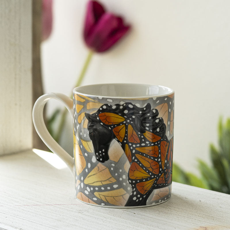 Mug with a black horse adorned with yellow-orange butterfly wings