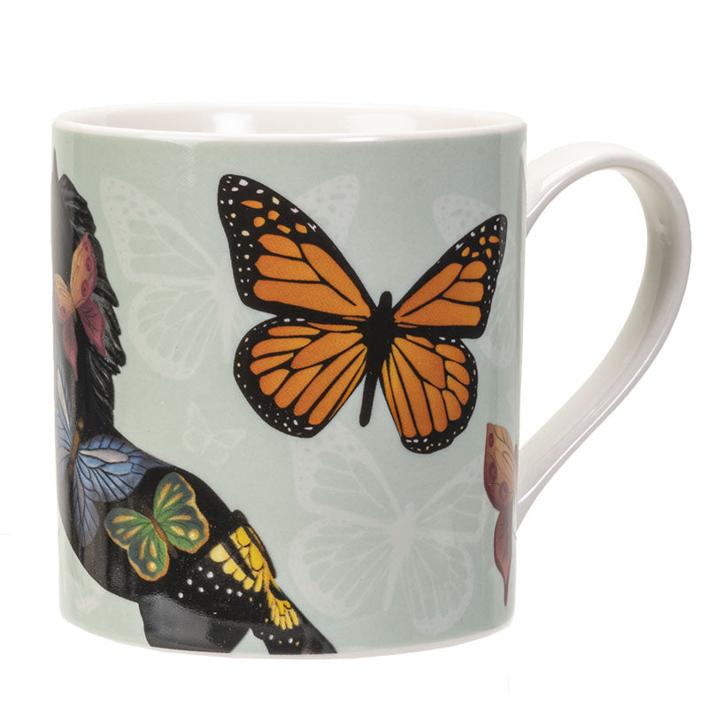 Mug with a design of a horse and butterflies on a light green background
