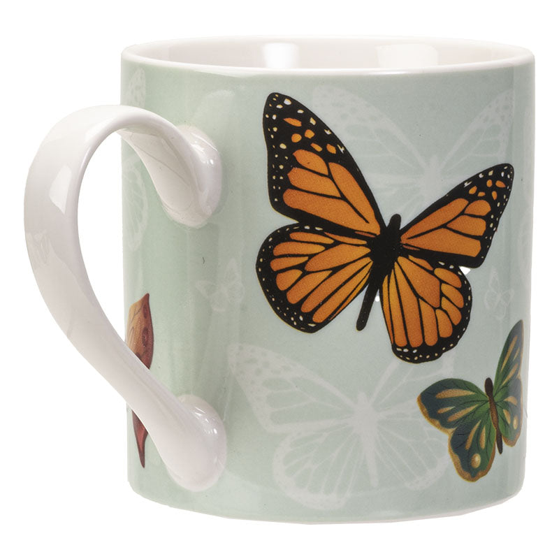 Mug with a design of a horse and butterflies on a light green background