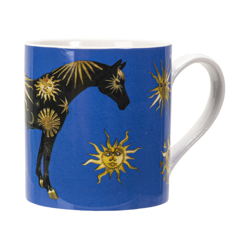 A blue ceramic mug featuring a black horse decorated with gold sun & moon motifs