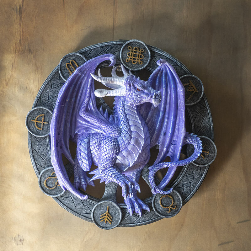Purple Samhain dragon on a black wheel with gold symbols