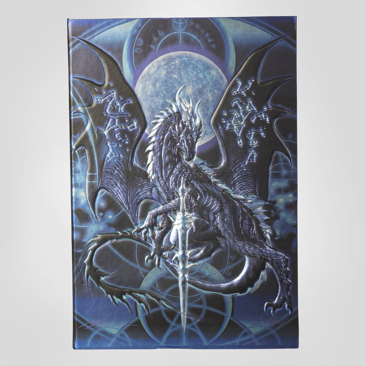 Journal, cover art by Ruth Thompson - blue black dragon with constellations on wings in front of full moon with glowing sword