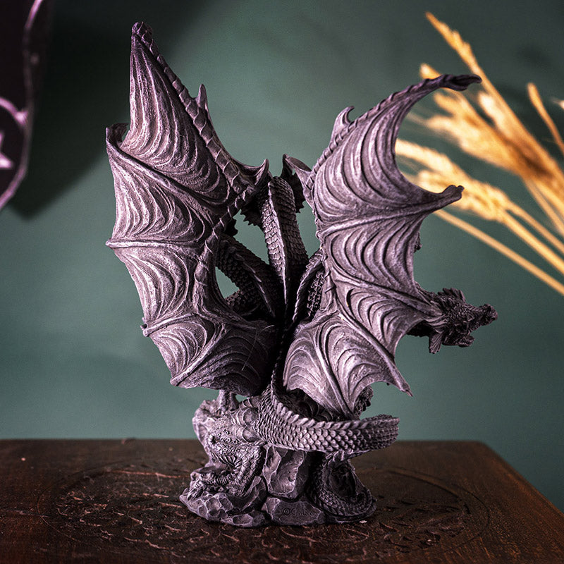 Figurine of gray faux-stone hydra dragon with flared wings and 5 heads, some snarling. Shown from the back