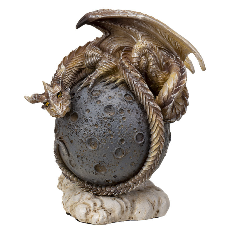 Figurine of a tan dragon on a gray moon orb