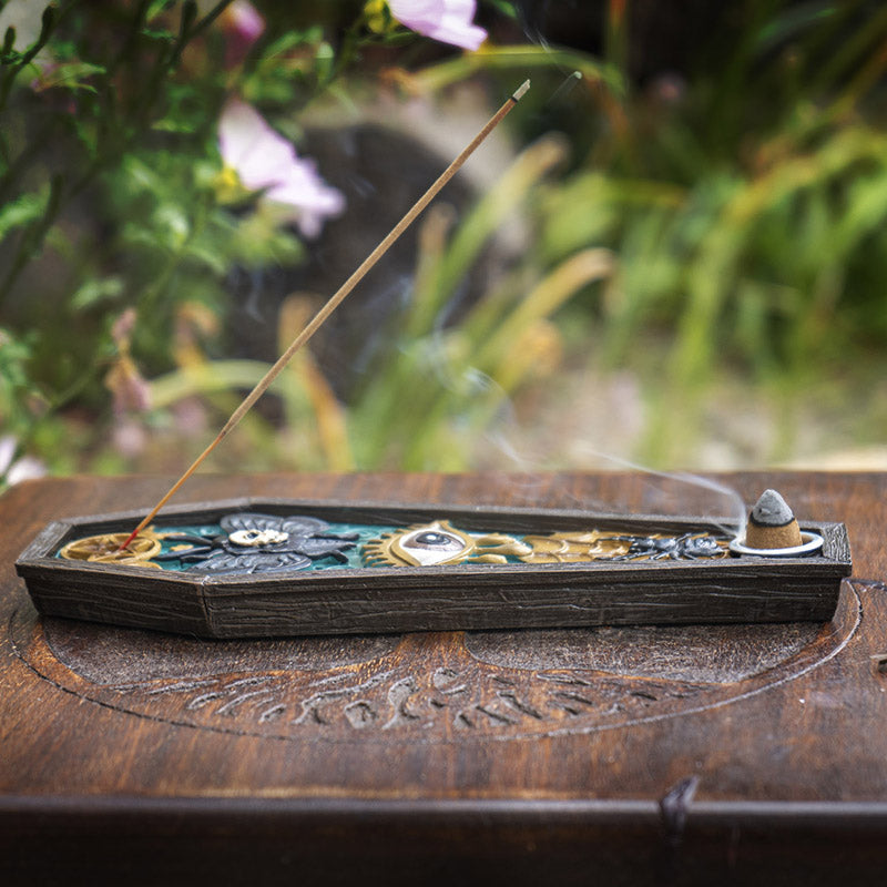 Decorative incense burner with moth, skull, and spider design