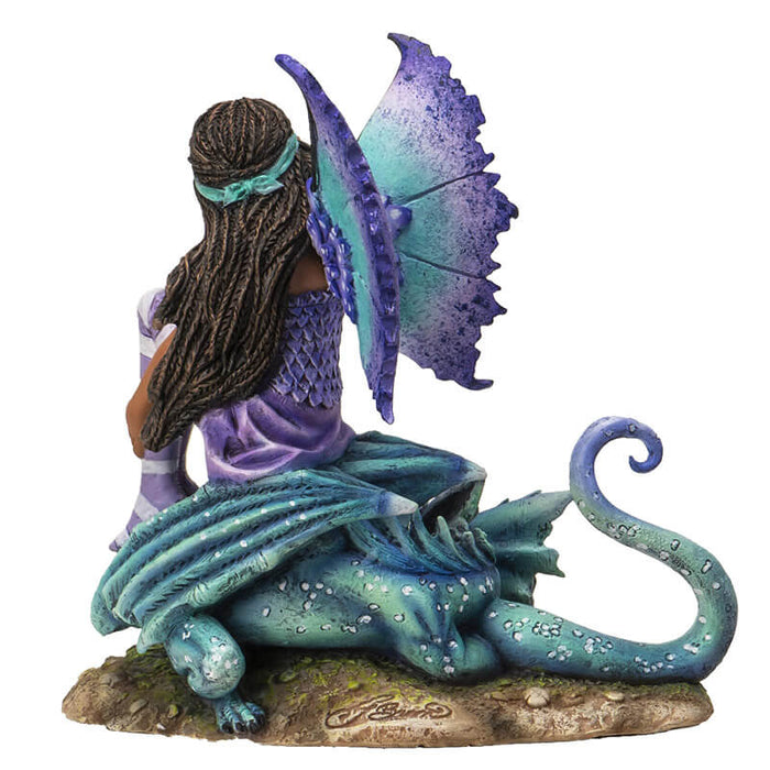 Back view - Figurine of fairy with braided hair, aqua and purple outfit sitting with teal and blue dragon