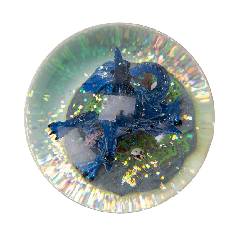 Snowglobe with blue dragon with red eyes within, castle base, shown top down with glitter