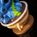 Closeup of mug of tea with blue and green dragon