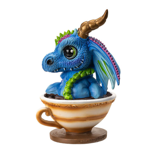 Figurine of blue, purple, green dragon with gold horns sitting in a cup of tea