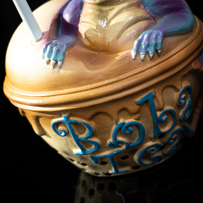 Closeup of Boba Tea label in blue font, dragon feet and bubbles