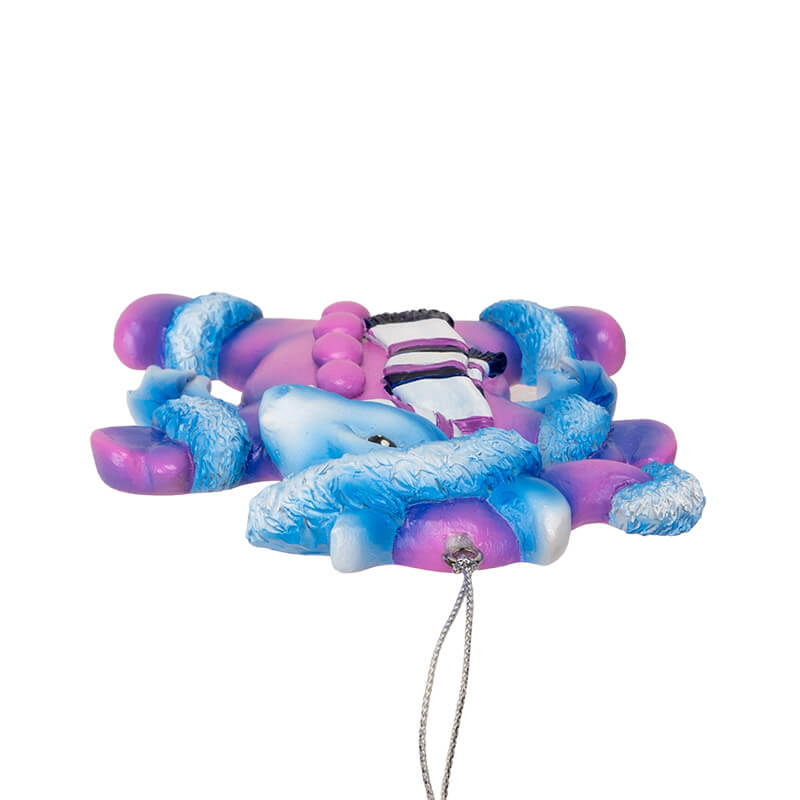 Blue dragon ornament in a purple snow suit with hat and scarf
