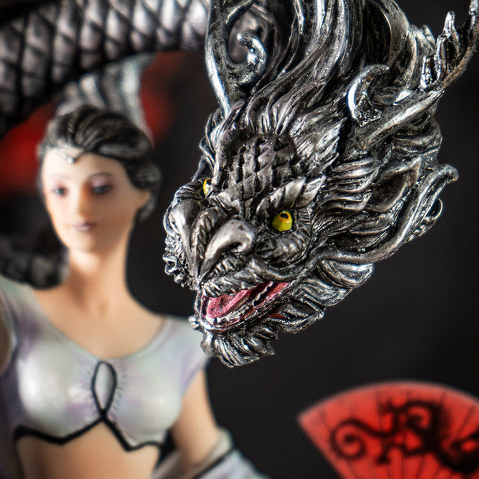 Closeup of black dragon with golden eyes