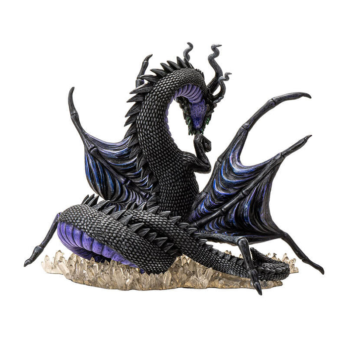 Figurine of a spider-dragon with purple and black scales and wings and eight eyes. Clutches crystals and sits on more gems. Back view