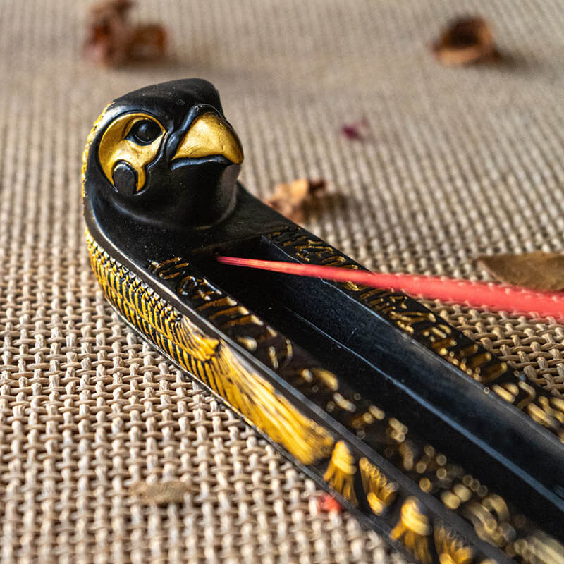 Incense burner with falcon headed Egyptian god Horus, black and gold with hieroglyphs