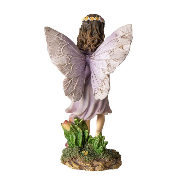 Figurine of a fairy with brown hair and flower crown carrying a basket of apples. Back view, detailed pale wings