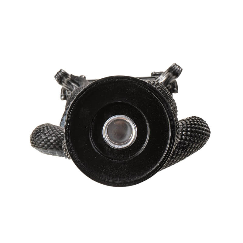 Candleholder of black snake twining through moon phases in silver with spot for taper candle at the top. Top down view showing spot for candle