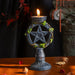 Faux stone candleholder with pentacle star in the center, Celtic knot and leave designs. shown with candle