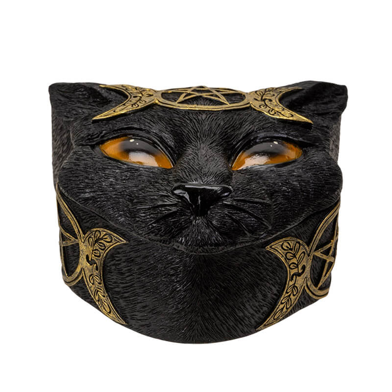 Trinket box shaped like a black cat head, orange eyes and gold triple moon designs.