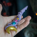 Magic wand in pale purple with orbs in gold, blue and pink with golden crescent moon topper