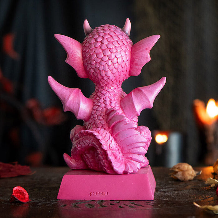 Figurine of pink dragon with fire sitting on base that says "A Princess With Her Own Dragon!" Back view