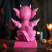 Figurine of pink dragon with fire sitting on base that says "A Princess With Her Own Dragon!" Back view