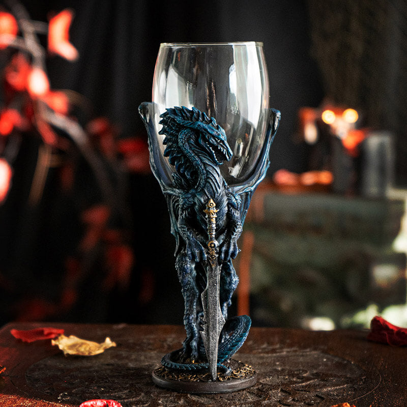 Glass topped goblet with a blue dragon holding a sword making up the stem