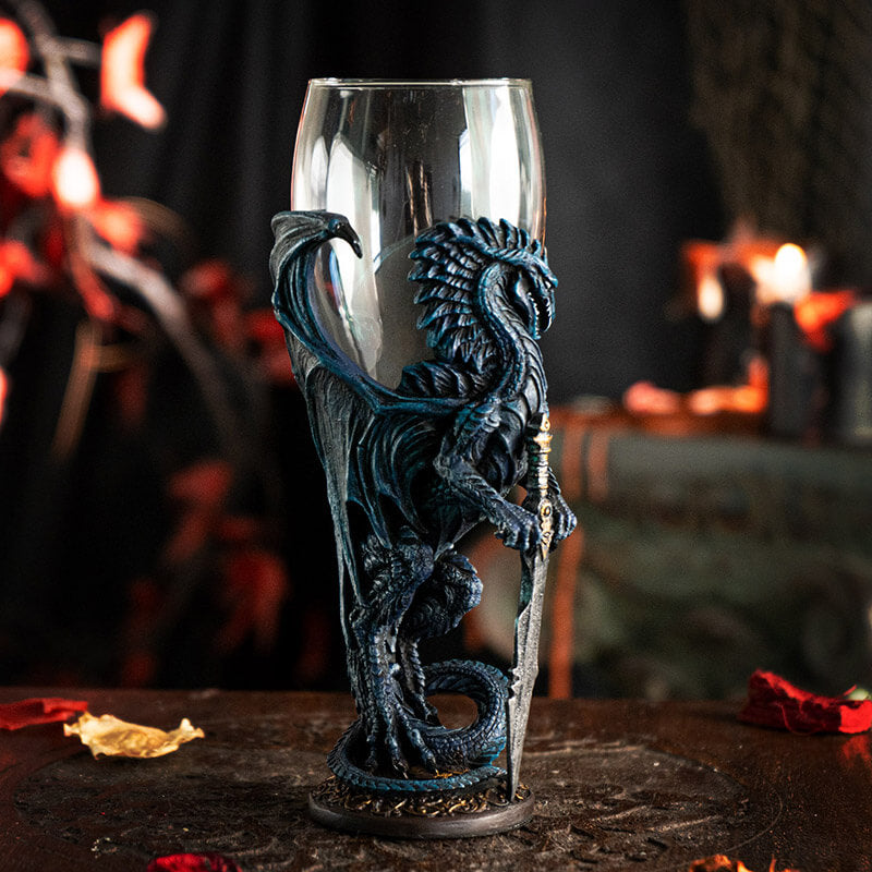 Glass topped goblet with a blue dragon holding a sword making up the stem