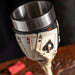 Goblet with stainless steel drinking insert. Skeletal hands hold four cards, showing both the backs and the aces on a poker-themed base.