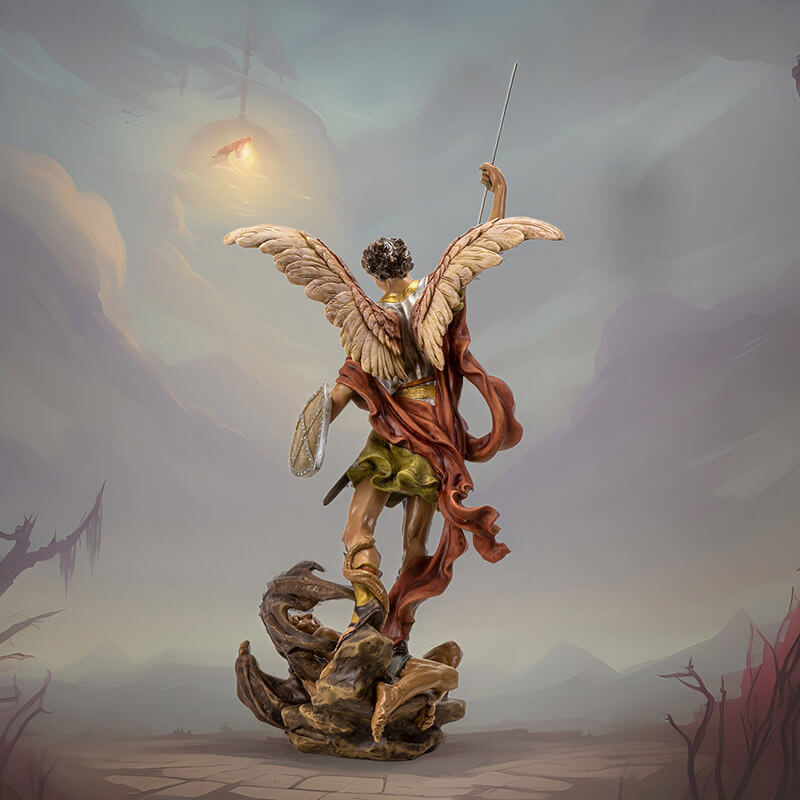 Figurine of angel St. Michael spearing the devil. Angel wears silver armor and has a shield, horned demon is at his feet. Shown from the back