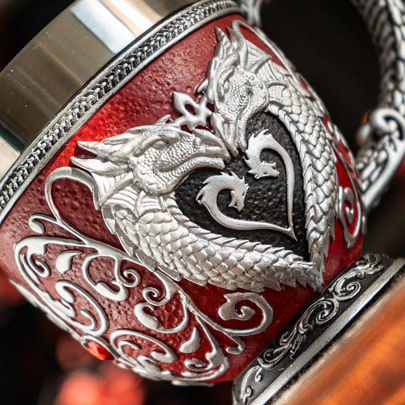 Teacup with stainless steel insert. Dragons in silver forming a heart on red background, swirls and crimson heart jewels.