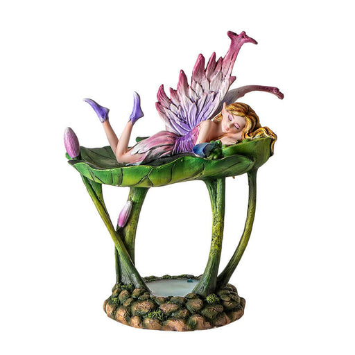 Figurine jewelry dish tray with raised lotus leaf above a pond. Fairy in pink and purple with winged frog on the leaf-dish